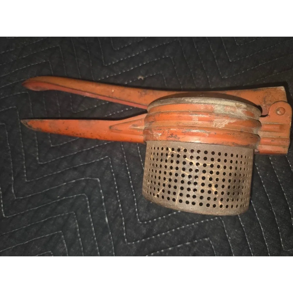 Vtg Orange Cast Metal Potato Ricer Fruit Press Hand Tool Rustic Kitchen Decor